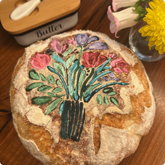 imagine Hand-painted bread shaped like a flower bouquet, on wooden table